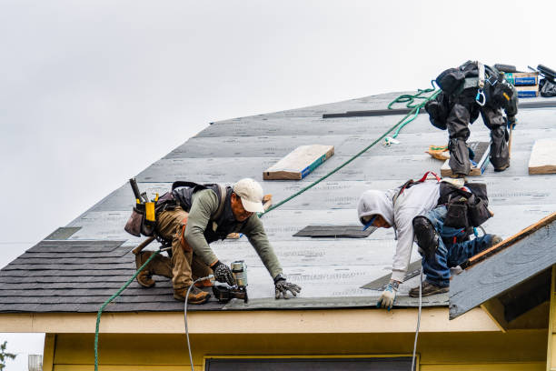 Professional Roofing technician working in Huxley, IA